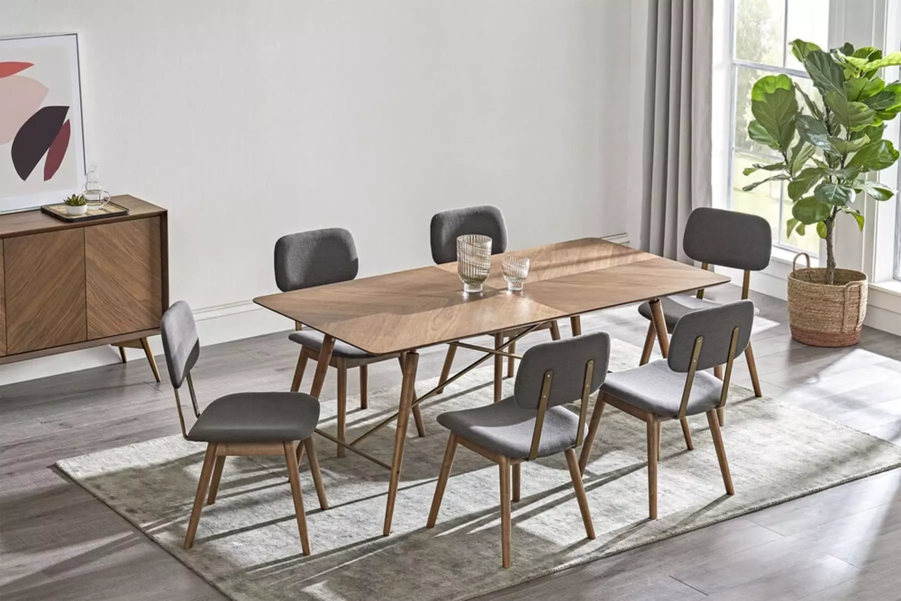 A wooden dining table set with tapered legs and matching chairs.