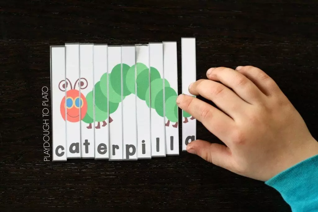 A word puzzle for students made from a drawing of a caterpillar cut into vertical strips. Each strip has a different letter of the word