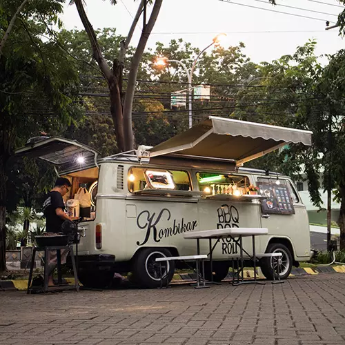 old time food truck on a brick road