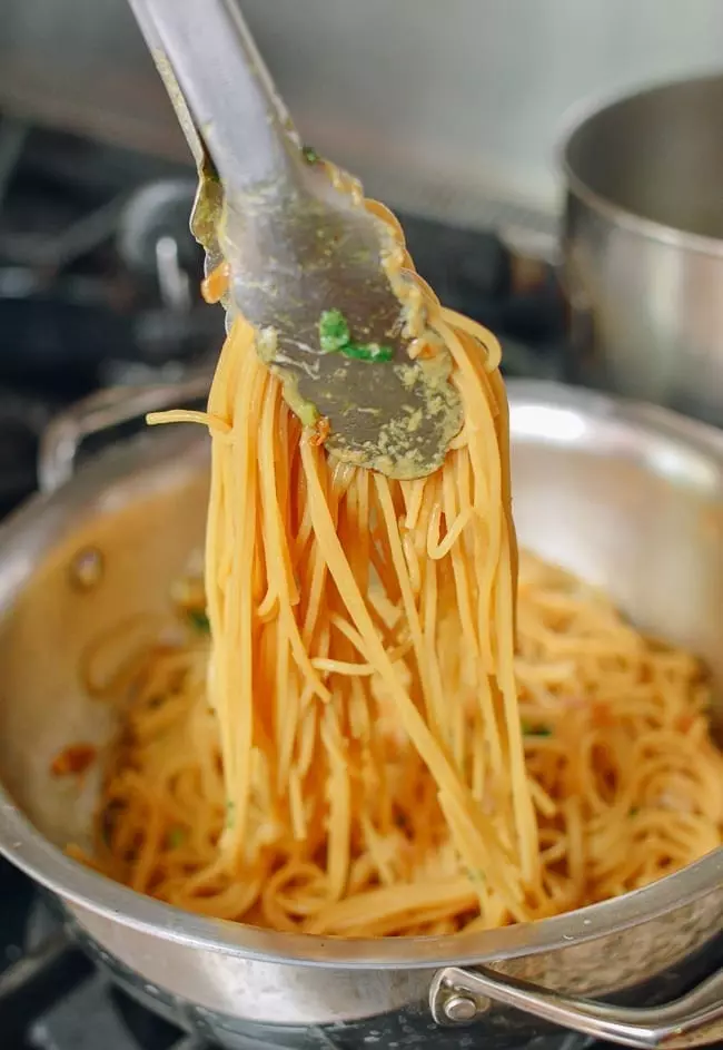 Tossing Garlic Noodles in Sauce