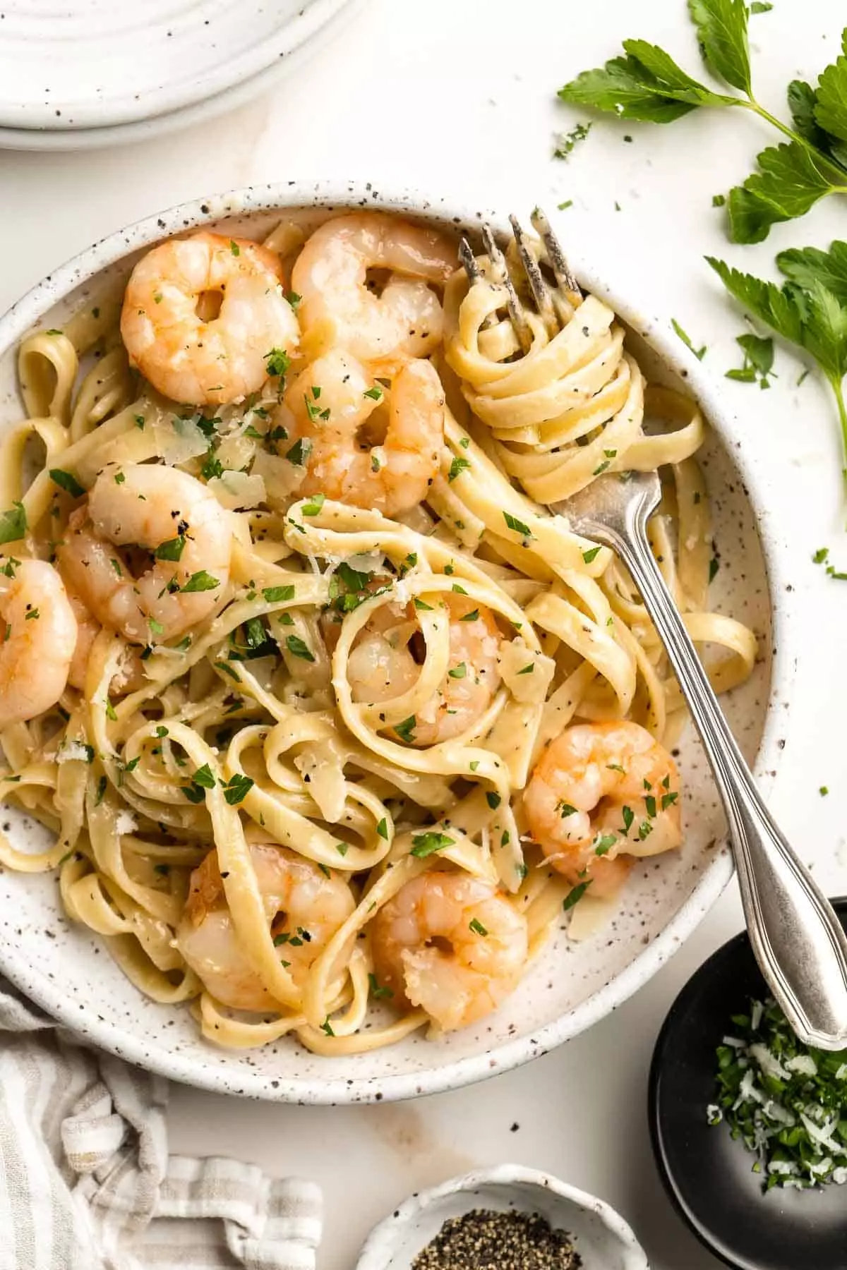 Shrimp Alfredo is creamy, garlicky, and delicious! This quick and easy, under 30-minute recipe is a go-to for busy nights and a year-round family favorite.