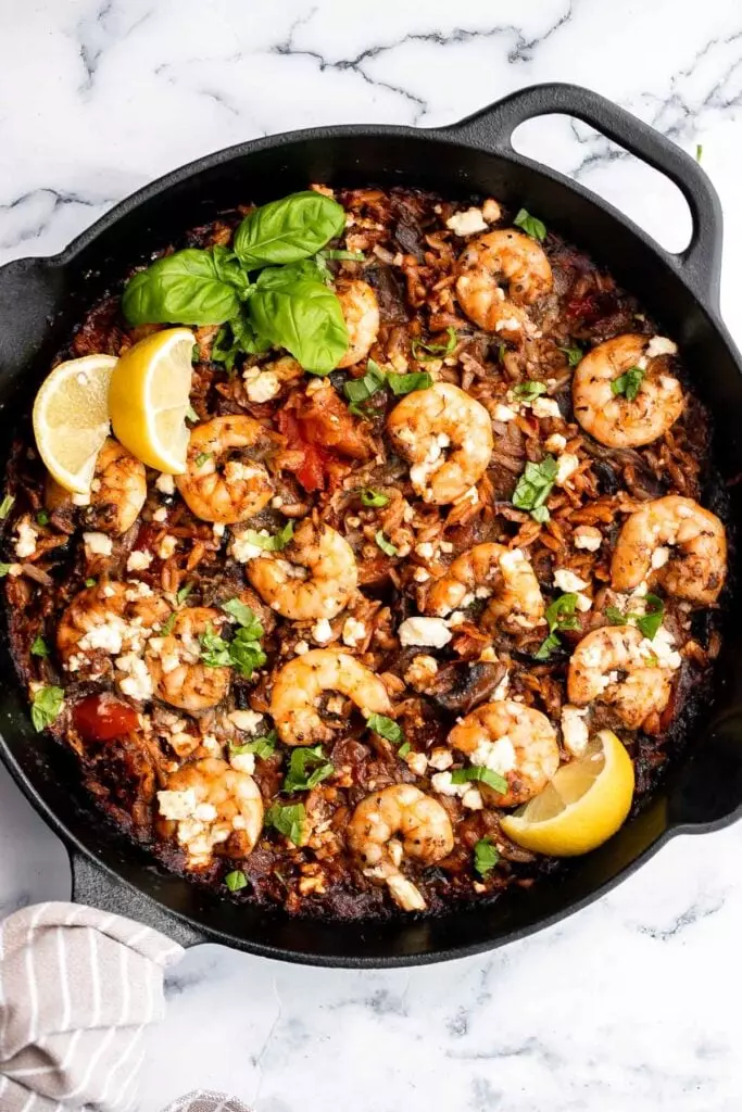 Mediterranean baked shrimp orzo is a complete wholesome one-pot meal with delicious sautéed vegetables, juicy shrimp, and orzo pasta. Make it in 30 minutes.