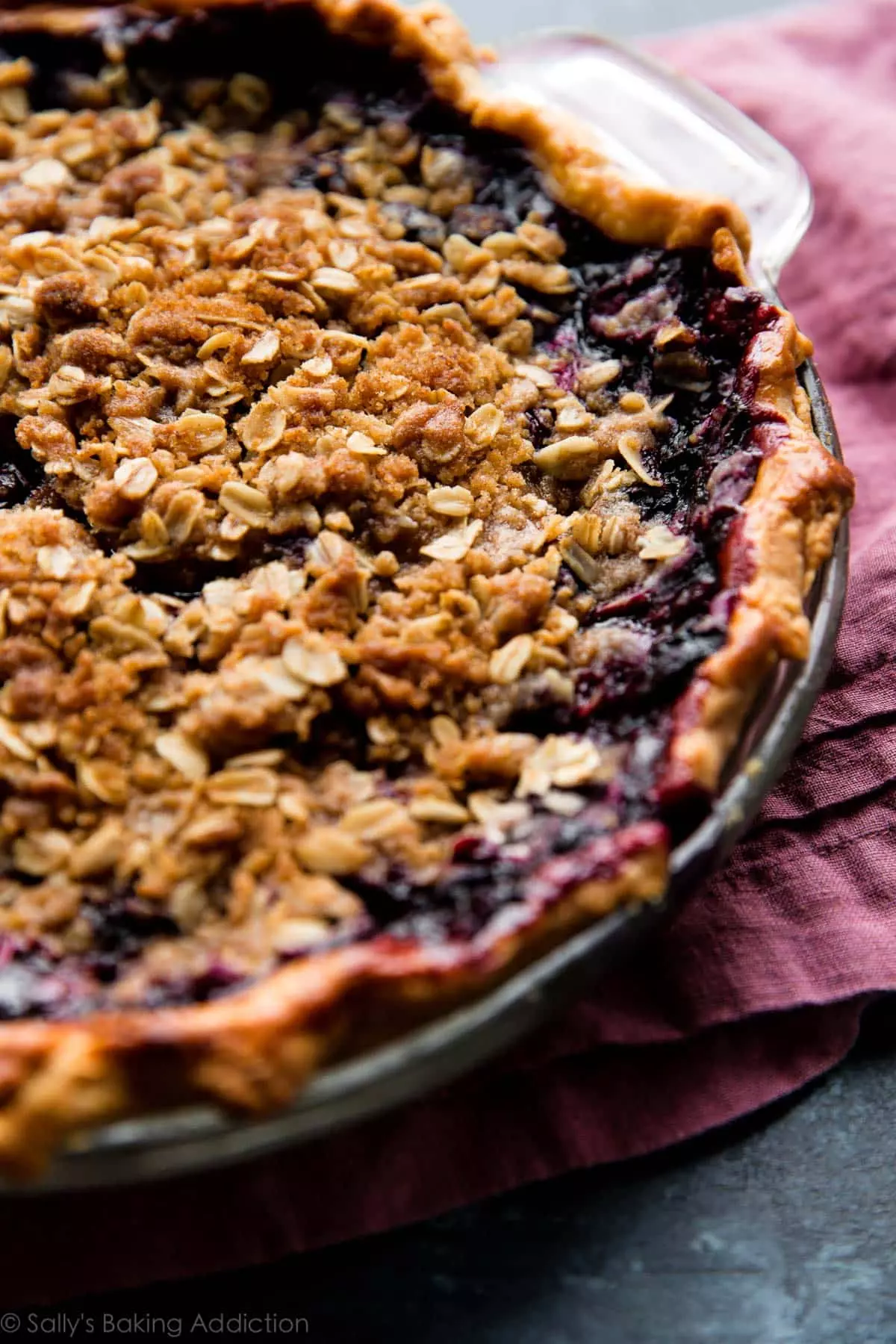 blueberry crumble pie in a glass pie dish after baking