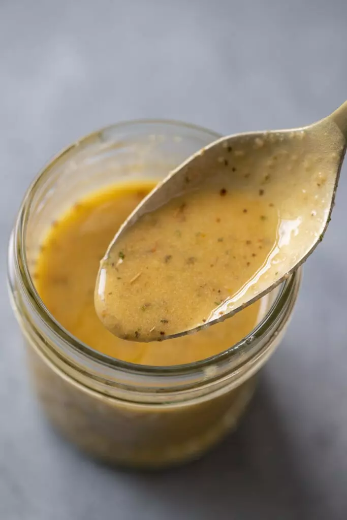 Avocado ranch dressing in a glass container