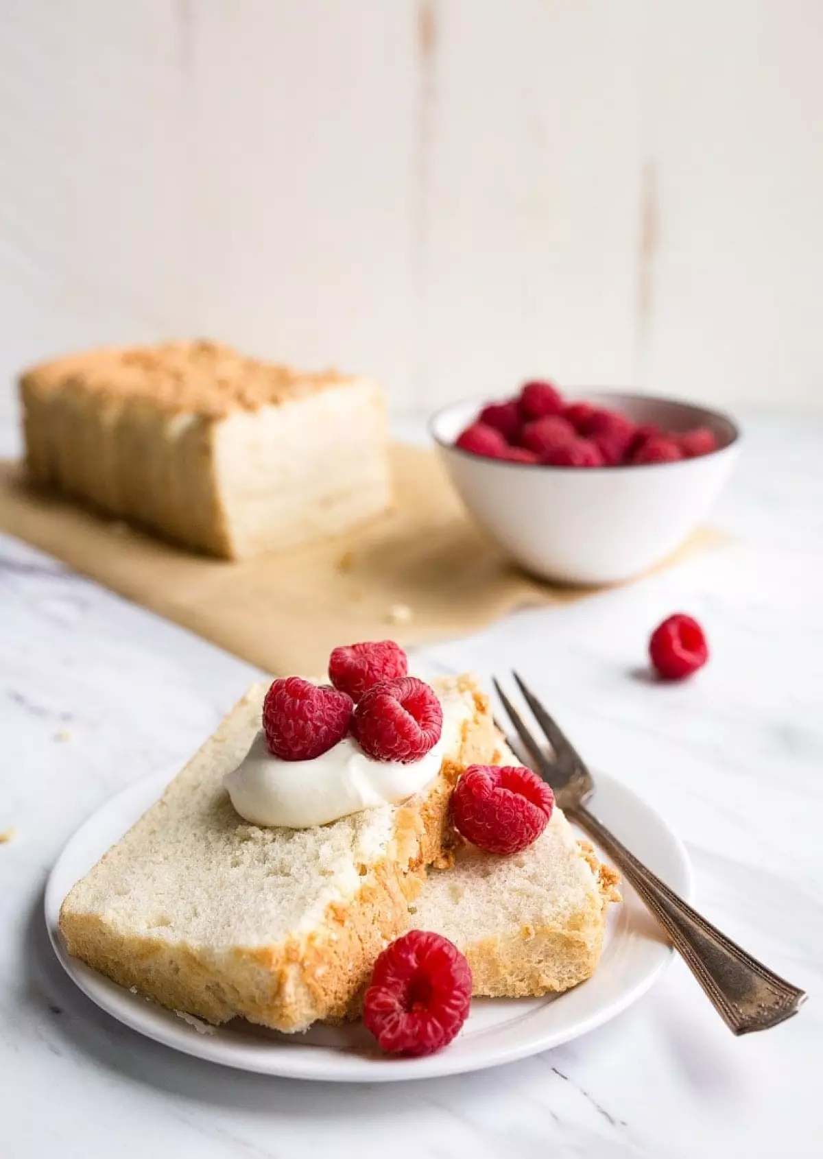 Mini Angel Food Cake in a Loaf Pan. Small angel food cake for one or two people made in a bread loaf pan that makes 8 slices.