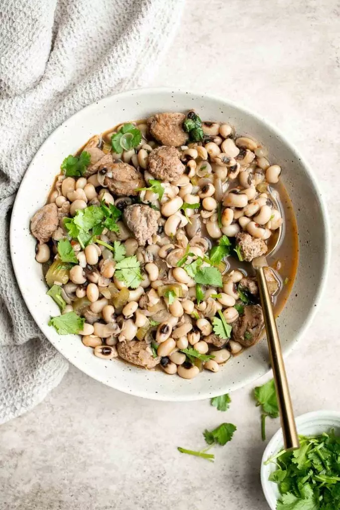 Southern Black Eyed Peas (Hoppin' John) is classic comfort food that is hearty, delicious, flavorful, and comforting. Serve it on New Year's for good luck.
