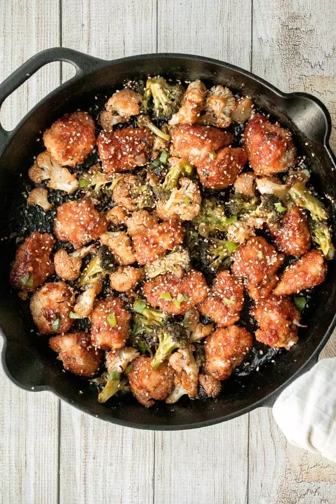 Better than takeout, baked sesame chicken with vegetables is delicious, flavorful, sticky, and saucy. This healthier Chinese dish is quick and easy to make.