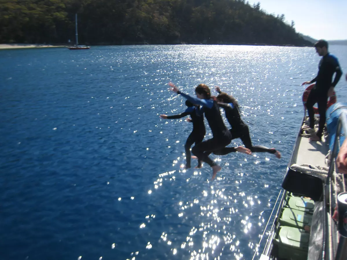 Jumping into the jellyfish waters of Australia covered by World Nomads Travel Insurance