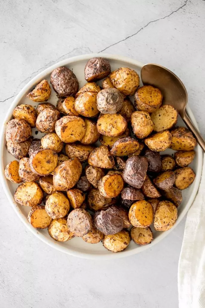 Crispy and tender, easy air fryer baby potatoes are a healthier take on a classic side dish without compromising taste or texture. Cooks in just 20 minutes.