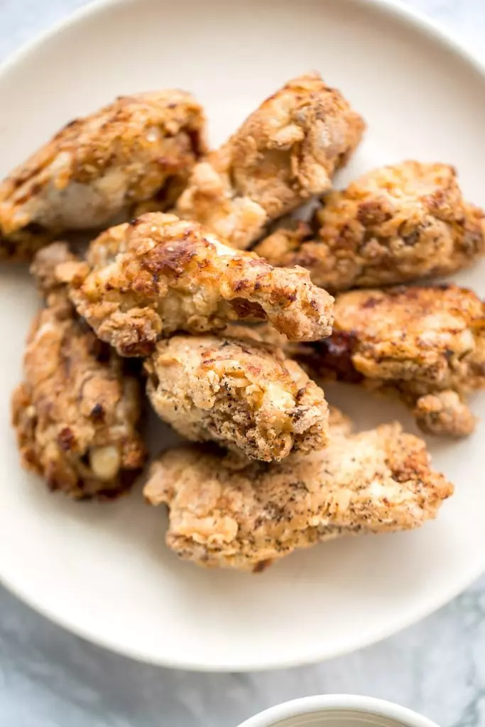 The BEST breaded fried chicken wings - extra crispy and crunchy outside, tender and juicy inside. You can't even tell they're air fried, not deep-fried!