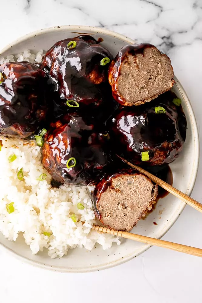 Lion's Head Chinese Meatballs are tender and juicy homemade pork meatballs packed with Asian seasonings and tossed in a sweet and sticky sauce.