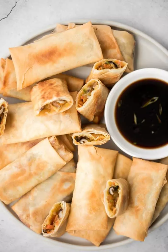 Better than takeout, light and crispy fried vegetarian spring rolls are packed with a tender mushroom and cabbage vegetarian filling in a crunchy skin.