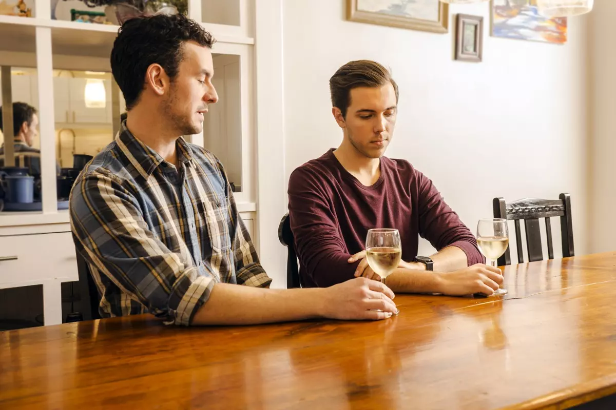 Male Gay Couple Sitting at a Dining Table