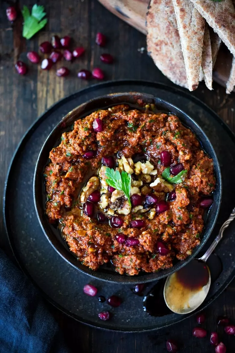 25 Festive Party appetizers like this simple, flavorful Middle Eastern-style, Roasted Red Pepper - Walnut Dip called Muhammara, with garlic, parsley and pomegranate molasses (recipe below), that can be made ahead in a food processor. Serve with toasted pita or crackers.