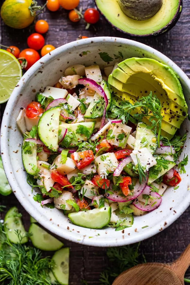 This vegan, plant-based Ceviche will transport you to Mexico. Made with hearts of palm and avocado, this easy recipe can be served on tostadas, with chips, or in lettuce cups! #veganceviche #heartsofpalm #veganmexican #ceviche