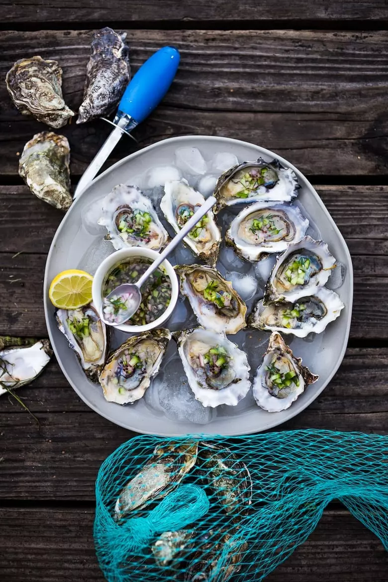 Fresh Oysters with Mustard Seed Mignonette with cucumber, shallot, and dill. | #oysters #appetizers #partyappetizers www.feastingathome.com