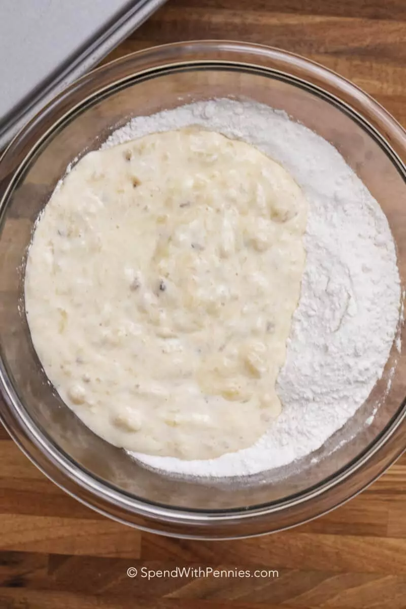 Combining ingredients in a bowl for an easy banana bread recipe